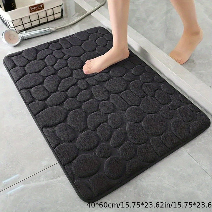Elegante, absorberende badmat in wit, voegt luxe en functionaliteit toe aan de badkamerinrichting.