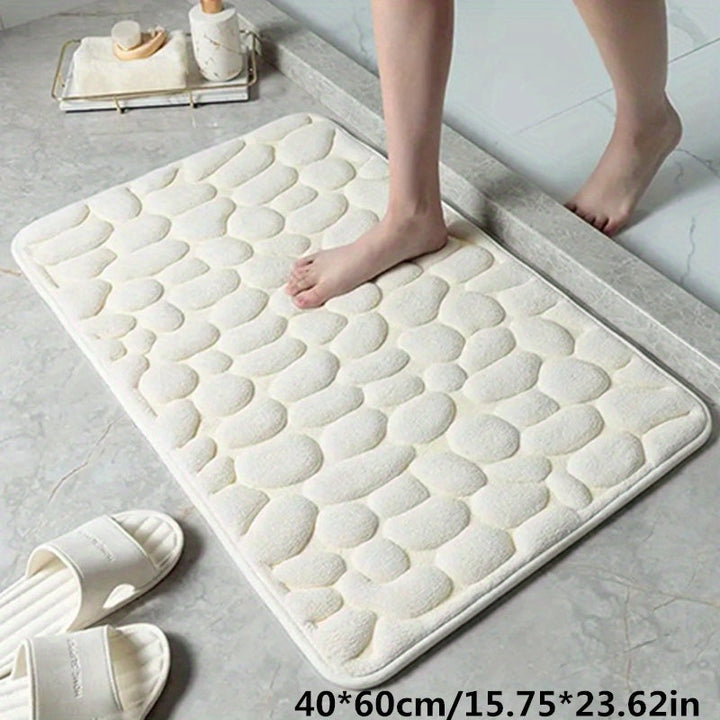 Functionele antislip badmat op tegelvloer, voorkomt uitglijden en houdt de badkamer droog en veilig.