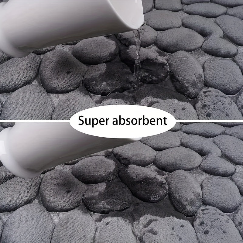 Detailopname van de pluizige, absorberende textuur van een witte badmat, comfortabel en functioneel.