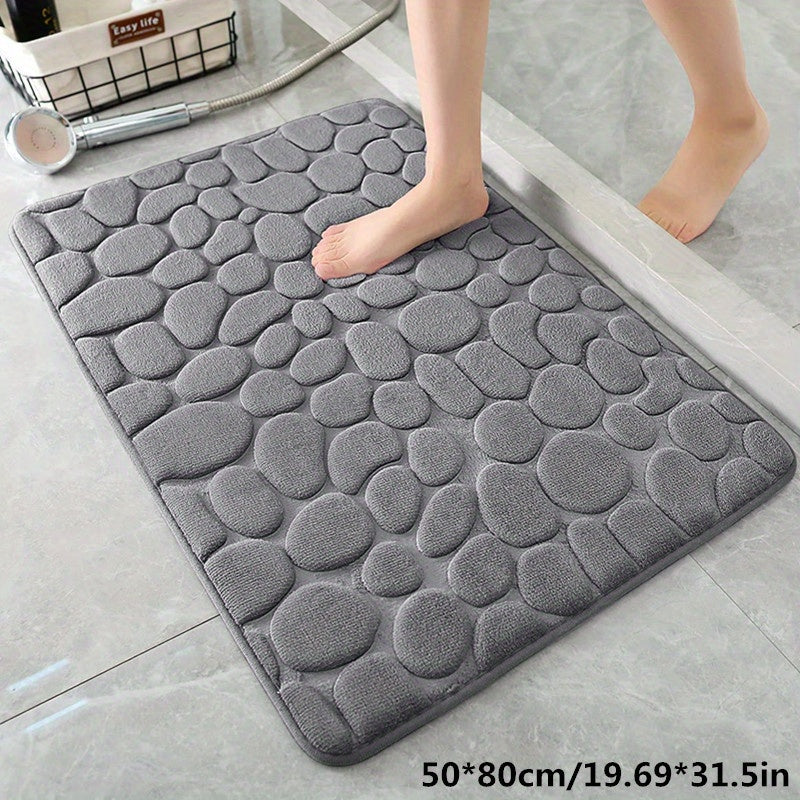 Grote antislip badmat, absorberend en comfortabel, onder een wastafel, zorgt voor droge voeten.