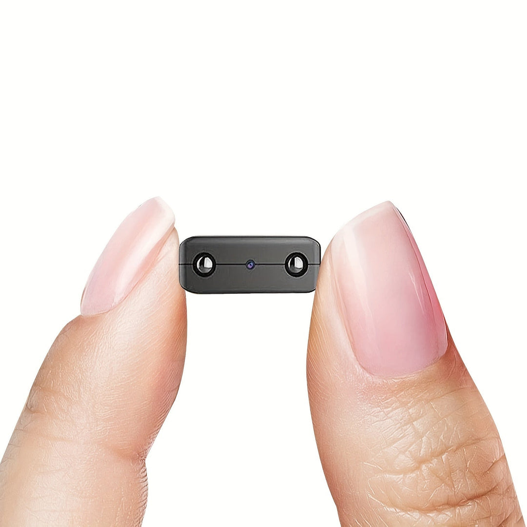 Ultra compacte mini camera met Full HD, nachtzicht en bewegingsdetectie, zwart met discrete lens en stevige behuizing.
