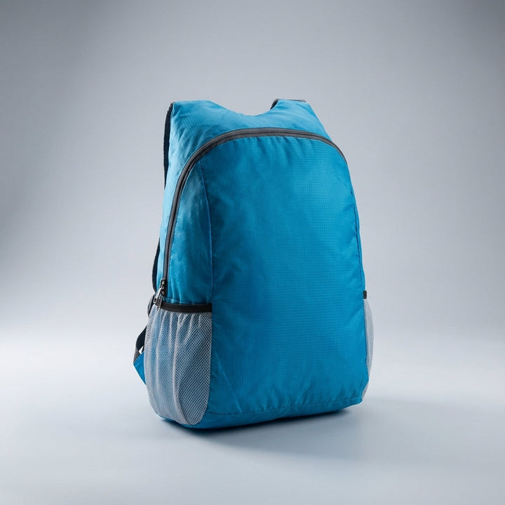 Compact opgevouwen reistas, past makkelijk in handbagage, perfect voor onverwachte aankopen.