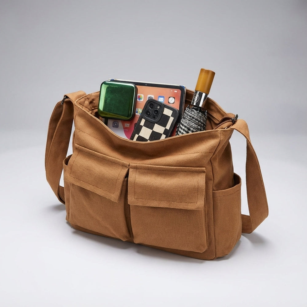 Open canvas messenger tas: Overzichtelijk interieur met meerdere vakken voor optimale organisatie.