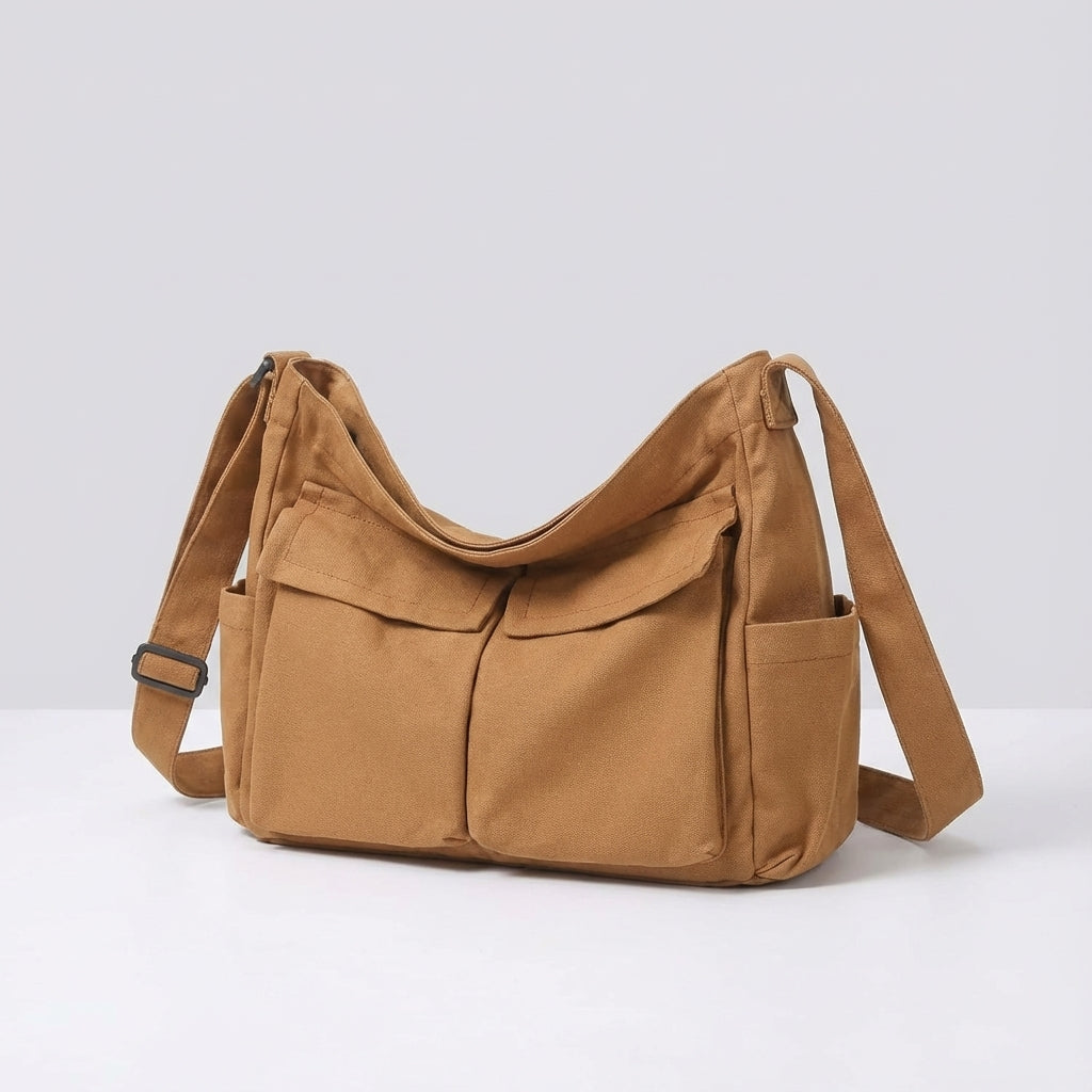 Zwarte canvas crossbody tas: Stijlvolle en functionele schoudertas met verstelbare riem, veelzijdig design.
