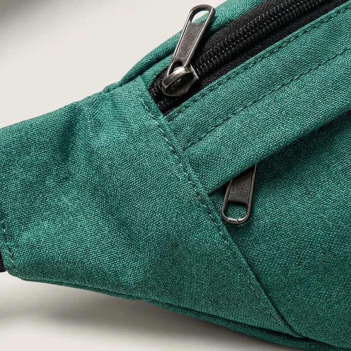 Unisex schoudertas & heuptas (FlexSling) met ritsvakken voor al je essentials.