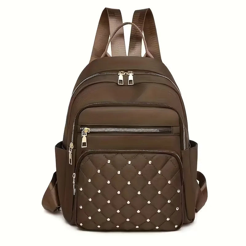 Gewatteerde unisex rugzak met studs, het ideale praktische accessoire voor herfst, winter en dagelijkse avonturen.