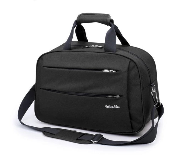 Duurzame nylon handbagage tas, zwart, met trolleybevestiging voor comfortabel reizen.