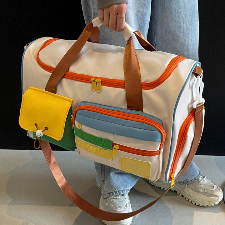 Compact opvouwbare lichtgewicht FlexaBag duffeltas met kleurblokken, ideaal voor handbagage en opslag.