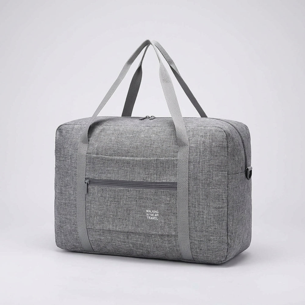 Compact opgevouwen Foldara reistas, perfect als extra tas of ruimtebesparende reisaccessoire.