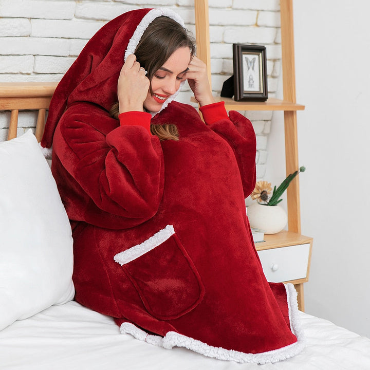 Winterse gezelligheid: een zachte, oversized hoodiedeken met capuchon en zakken voor totale ontspanning.
