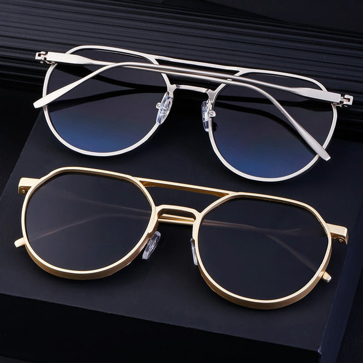 Gedurfde unisex zonnebril, stijlvol en premium, met zilveren details; perfect voor zomerse dagen.