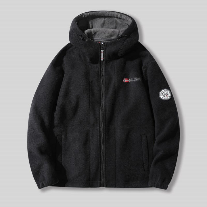 "Unisex ultra warme fleece jas in zacht materiaal voor heren en dames, perfect voor koude winterdagen met praktische zakken."