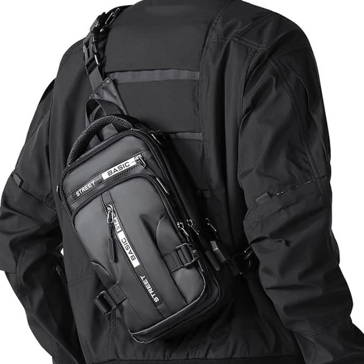 Unisex UrbanLite compacte crossbody sling rugzak, zwart nylon, ideaal voor dagelijks gebruik en reizen.