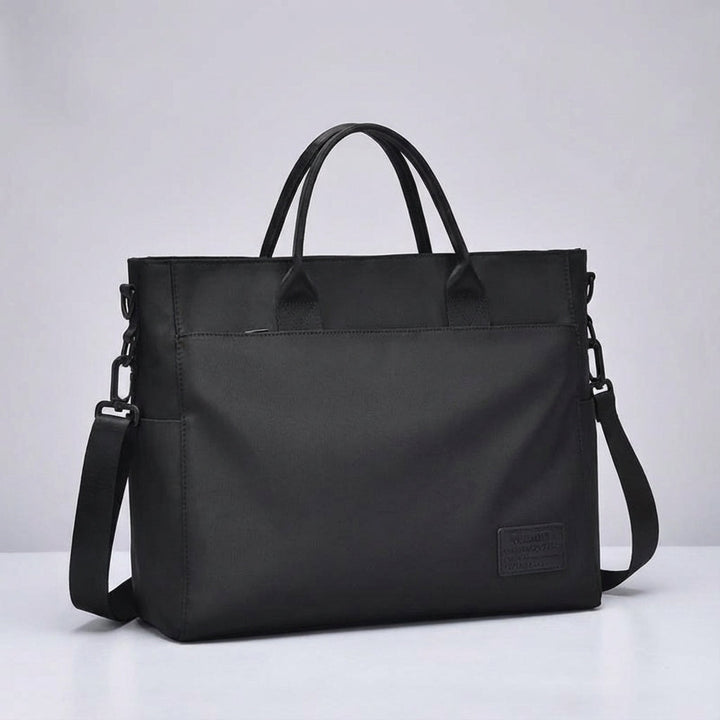 Stijlvolle unisex waterafstotende schoudertas met ruim compartiment voor laptop en tablet.