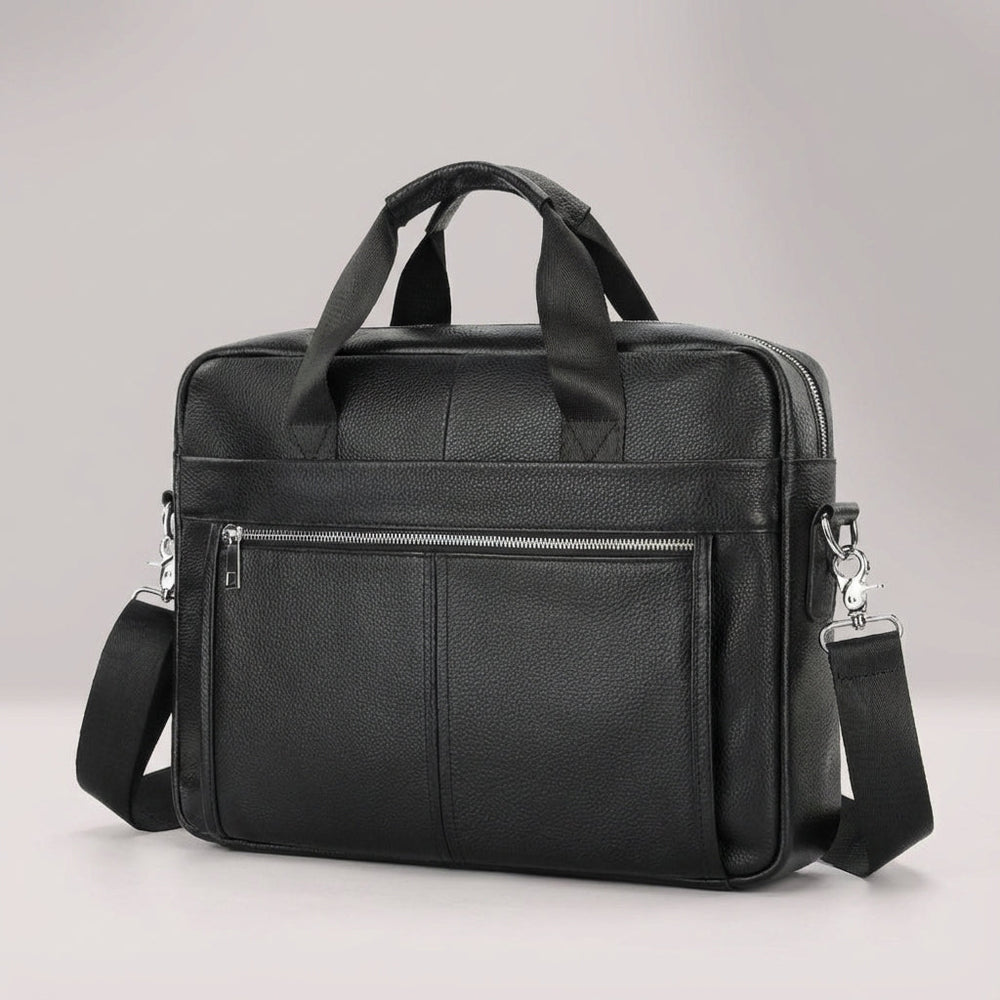 Open vintage rundleer aktetas met laptopvak en ruimte voor documenten; ideaal voor werk.