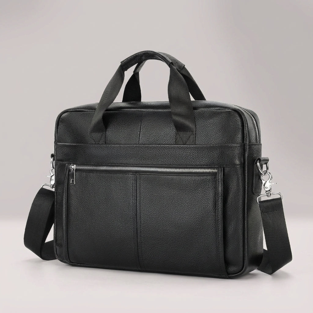 Open vintage rundleer aktetas met laptopvak en ruimte voor documenten; ideaal voor werk.