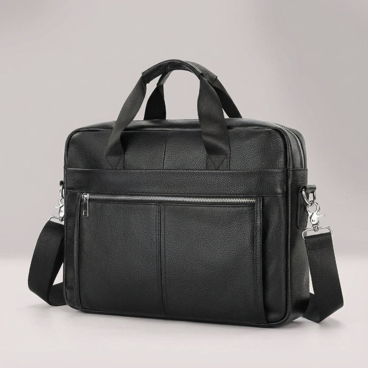 Open vintage rundleer aktetas met laptopvak en ruimte voor documenten; ideaal voor werk.