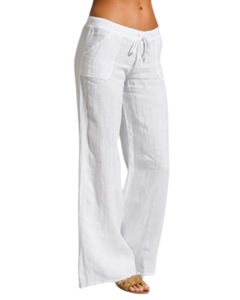 Vrouw draagt elegante, luchtige linnen broek met elastische taille in zwart. Perfect voor casual en formele gelegenheden.