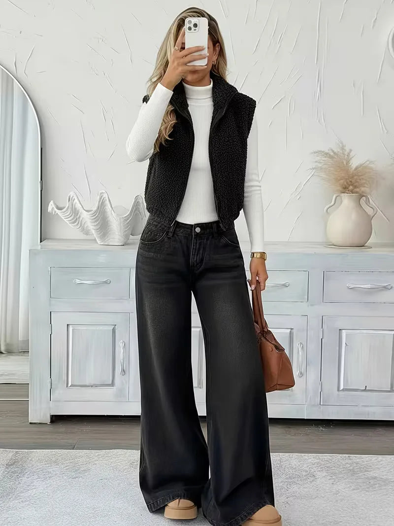 Trendy zwart dames vest, mouwloos en warm, met rits en faux shearling voering.