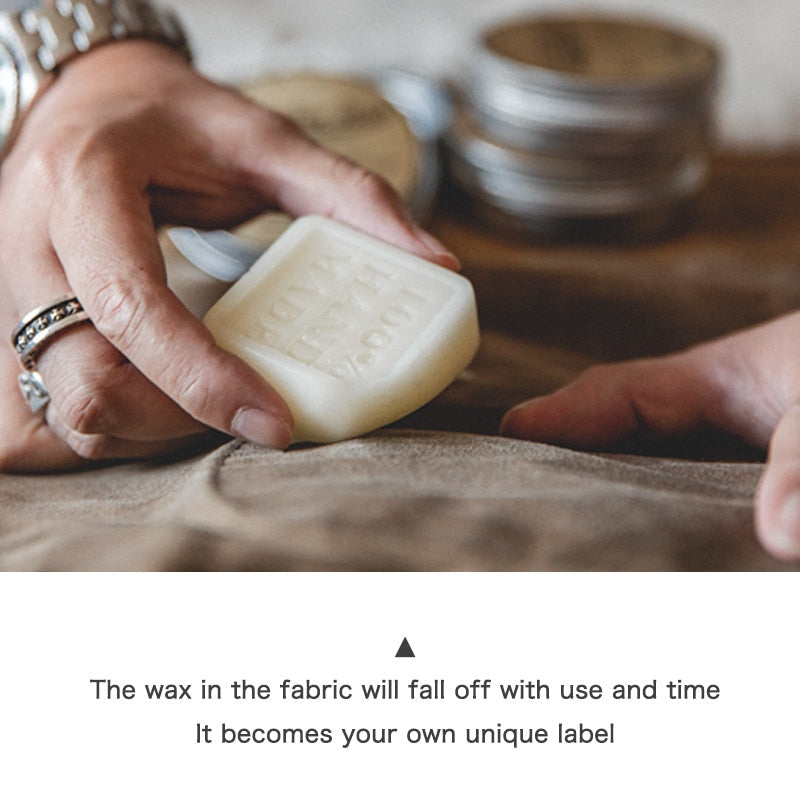 "Waterafstotende waxed canvas herenjas met vintage design, knoopsluiting en borstzakken, ideaal voor elk seizoen."