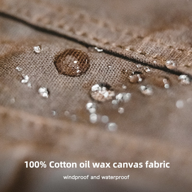 "Waterafstotende waxed canvas herenjas met vintage design, knoopsluiting en borstzakken, ideaal voor elk seizoen."