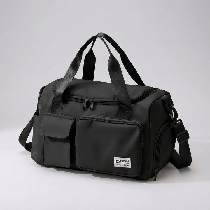 Klassieke zwarte unisex waterbestendige Travellea duffeltas van nylon, veelzijdige reistas en sporttas.