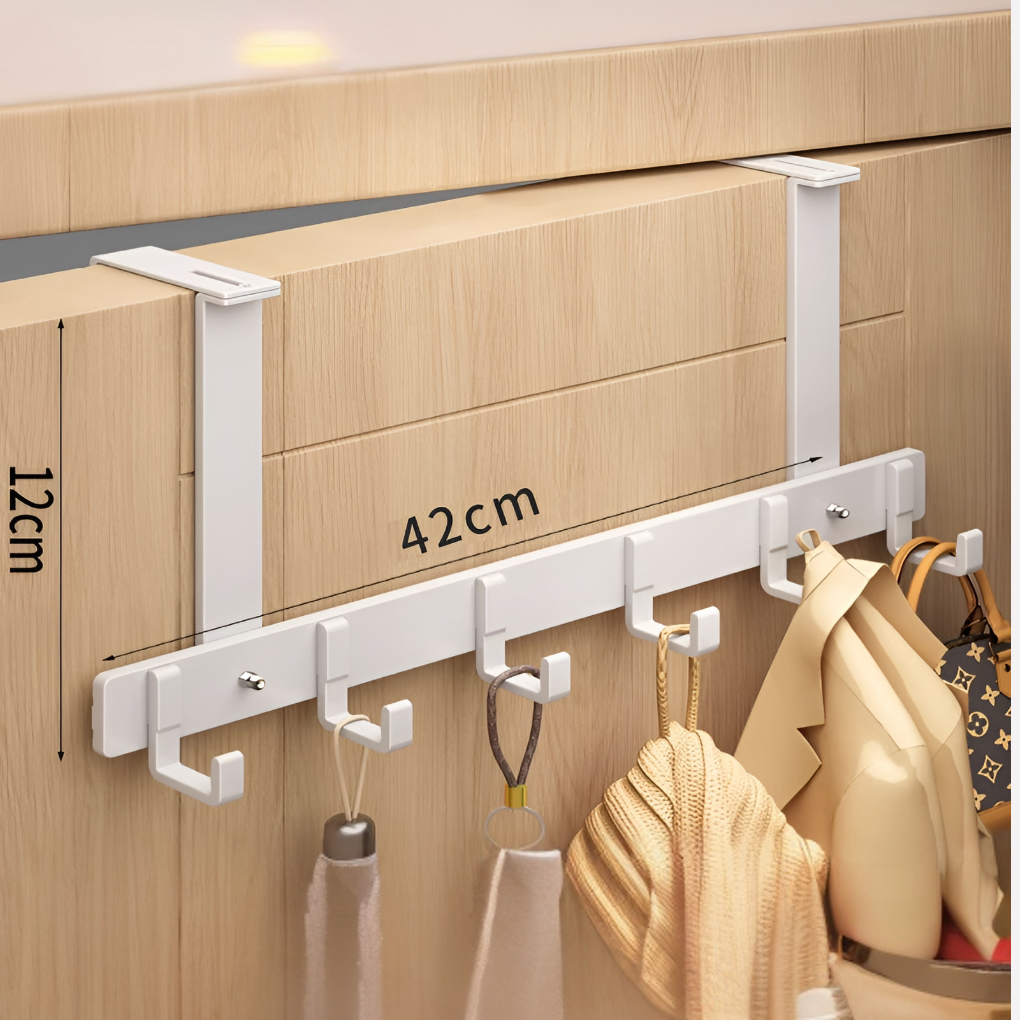 Wit deur hakenrek met 6 haken, ideaal voor ruimtebesparende organisatie in badkamer of slaapkamer.