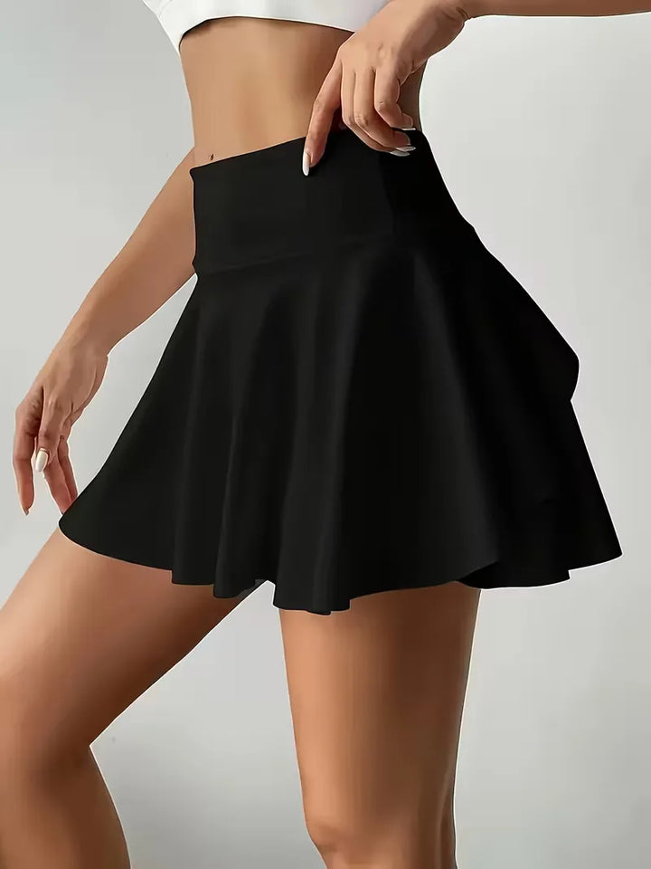 Dames plooirok met hoge taille, stretch en handige zijzakken. Geschikt voor sport of casual zomerlook.