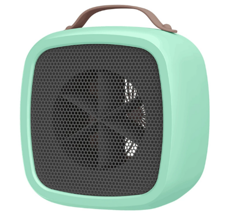 Groene compacte ventilatorkachel op een houten vloer, zorgt voor winterwarmte en zomers comfort in huis.