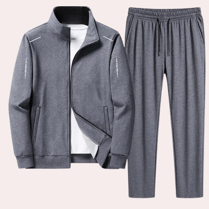 "Zwart heren trainingspak met jas, opstaande kraag en elastische tailleband voor ultiem comfort en stijlvol design."