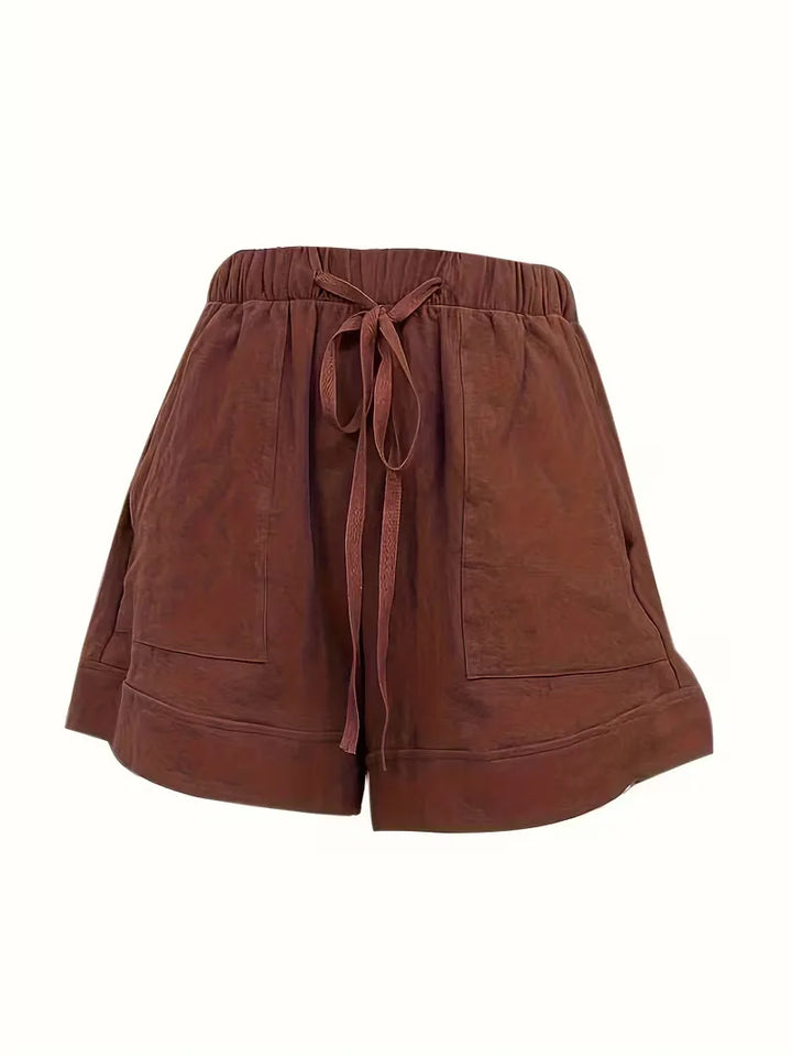 Lila casual dameshorts, wijde pijpen, comfortabel. Perfecte zomerse veelzijdigheid.