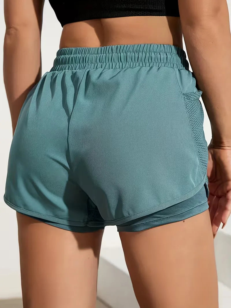 Petrolblauwe ademende sportieve korte broek voor dames, met elastische taille voor comfort.