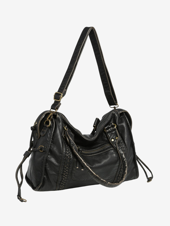 Praktische dames crossbody tas in zwart vegan leer, open voor een kijkje op functionele compartimenten.
