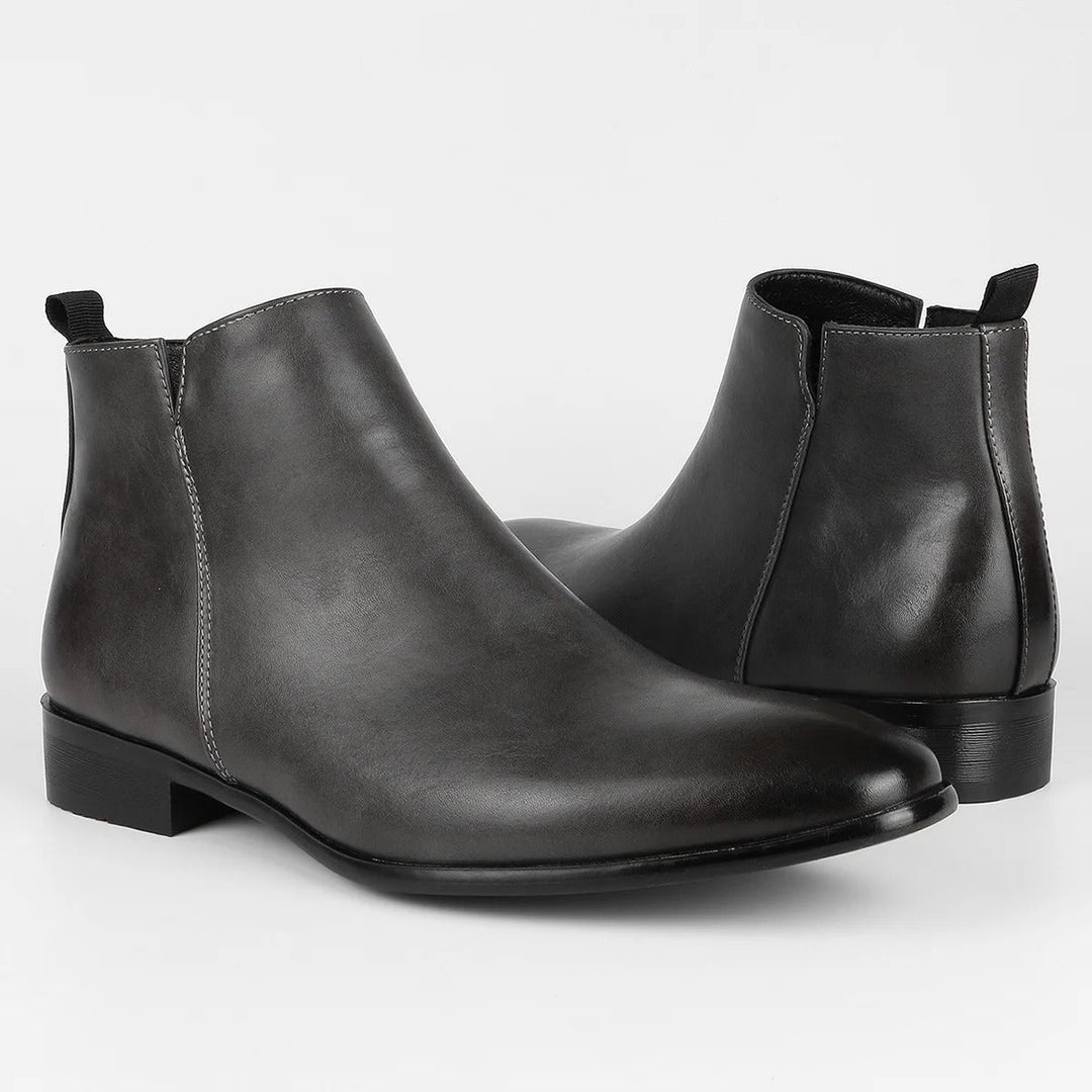 Retro-geïnspireerde heren Chelsea boots met moderne ritssluiting, perfect voor een modieuze look.