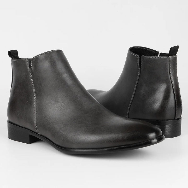 Retro-geïnspireerde heren Chelsea boots met moderne ritssluiting, perfect voor een modieuze look.