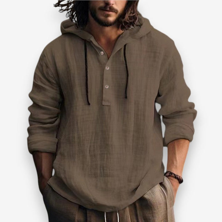 Casual herenkleding: blauwe hoodie met capuchon, knoopsluiting en zachte stof.