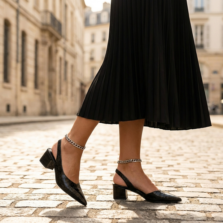 Zwarte orthopedische croco pumps voor dames, elegant en comfortabel, ideaal voor formele gelegenheden.