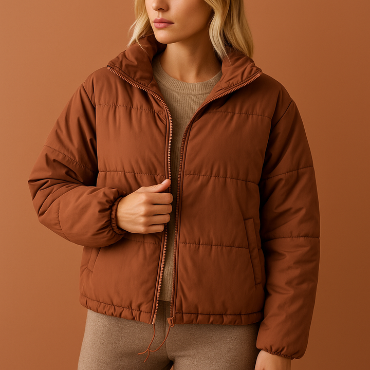 Bruine stijlvolle oversized donsjas voor dames, gewatteerd en warm, een trendy en comfortabele keuze voor de winter.