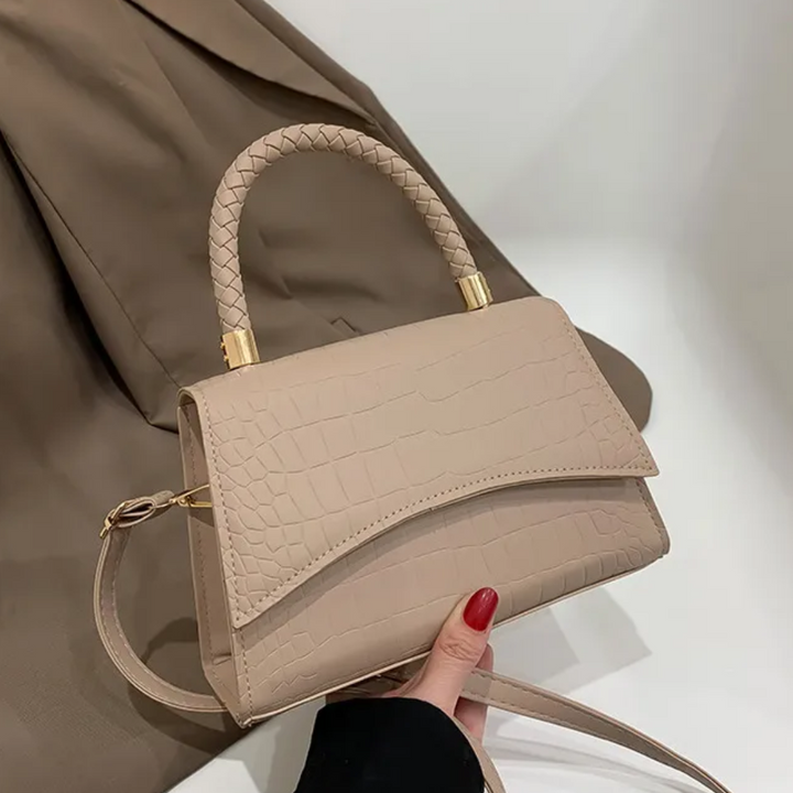 Elegante zwarte dames handtas van PU leer, met stevig bovenhandvat. Veelzijdig als schouder- en crossbodytas.