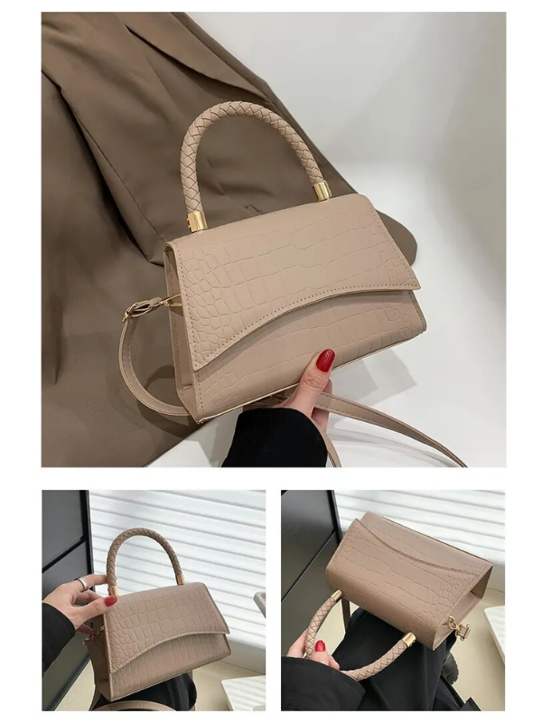 Modieuze zwarte dames handtas, gemaakt van PU leer. Stijlvol met bovenhandvat, ideaal als schouder- of crossbodytas.