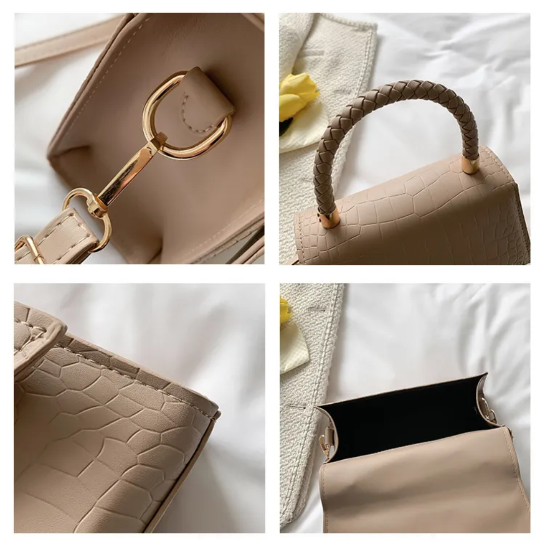 Zwarte PU leren dames handtas gedragen als stijlvolle schoudertas. Elegant accessoire met bovenhandvat.