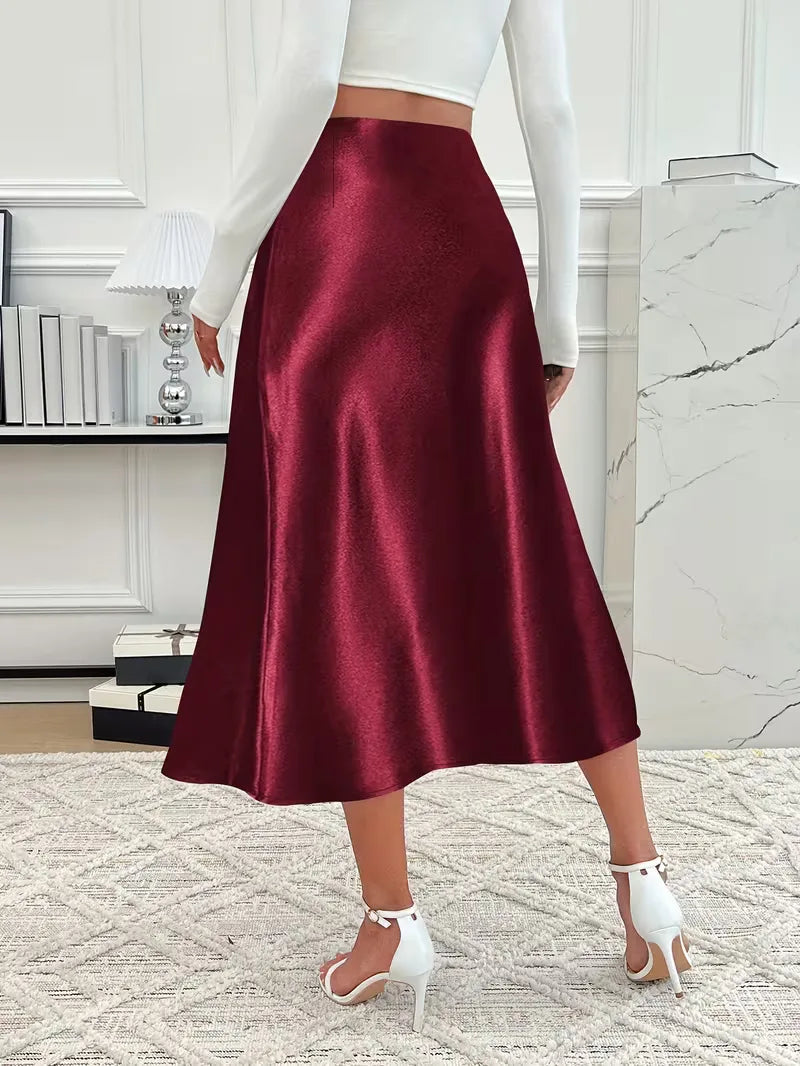 Roze satijnen midi rok met hoge taille, flatterend en trendy voor dames.