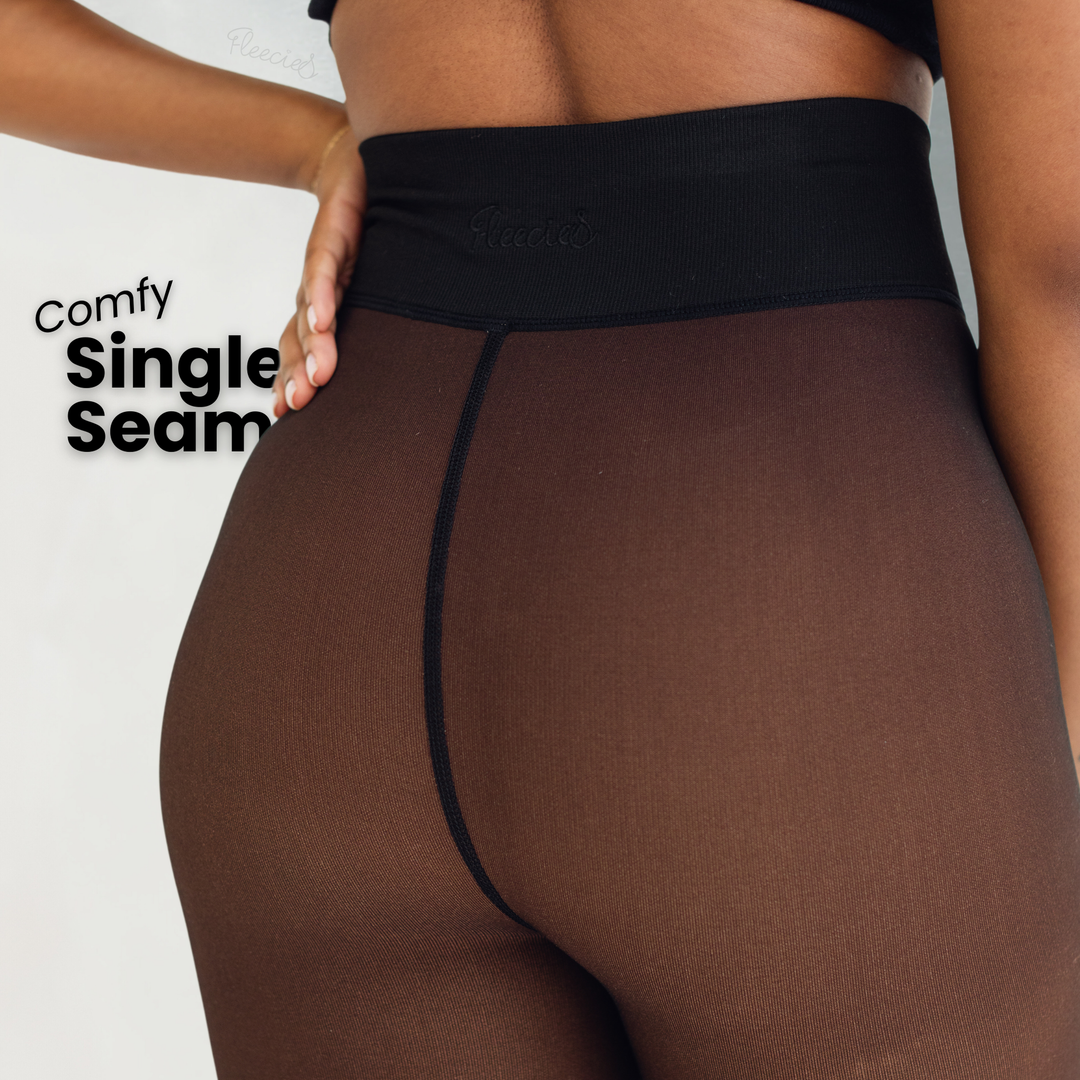 "Zwarte slimfit fleece panty met transparante look en vormend effect voor stijl en warmte in de koude maanden."