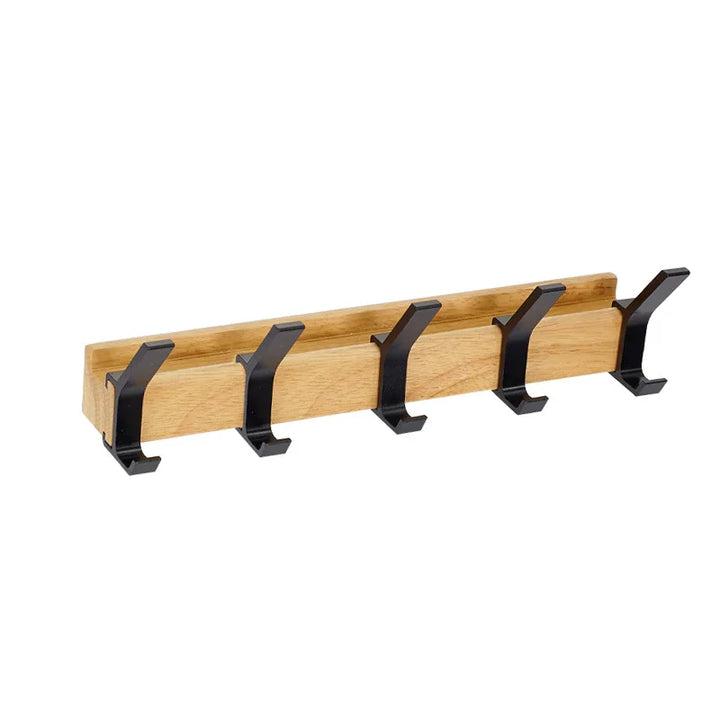 Compacte zwarte wandkapstok met verplaatsbare haken. Modern minimalistisch design voor optimale ruimte benutting.